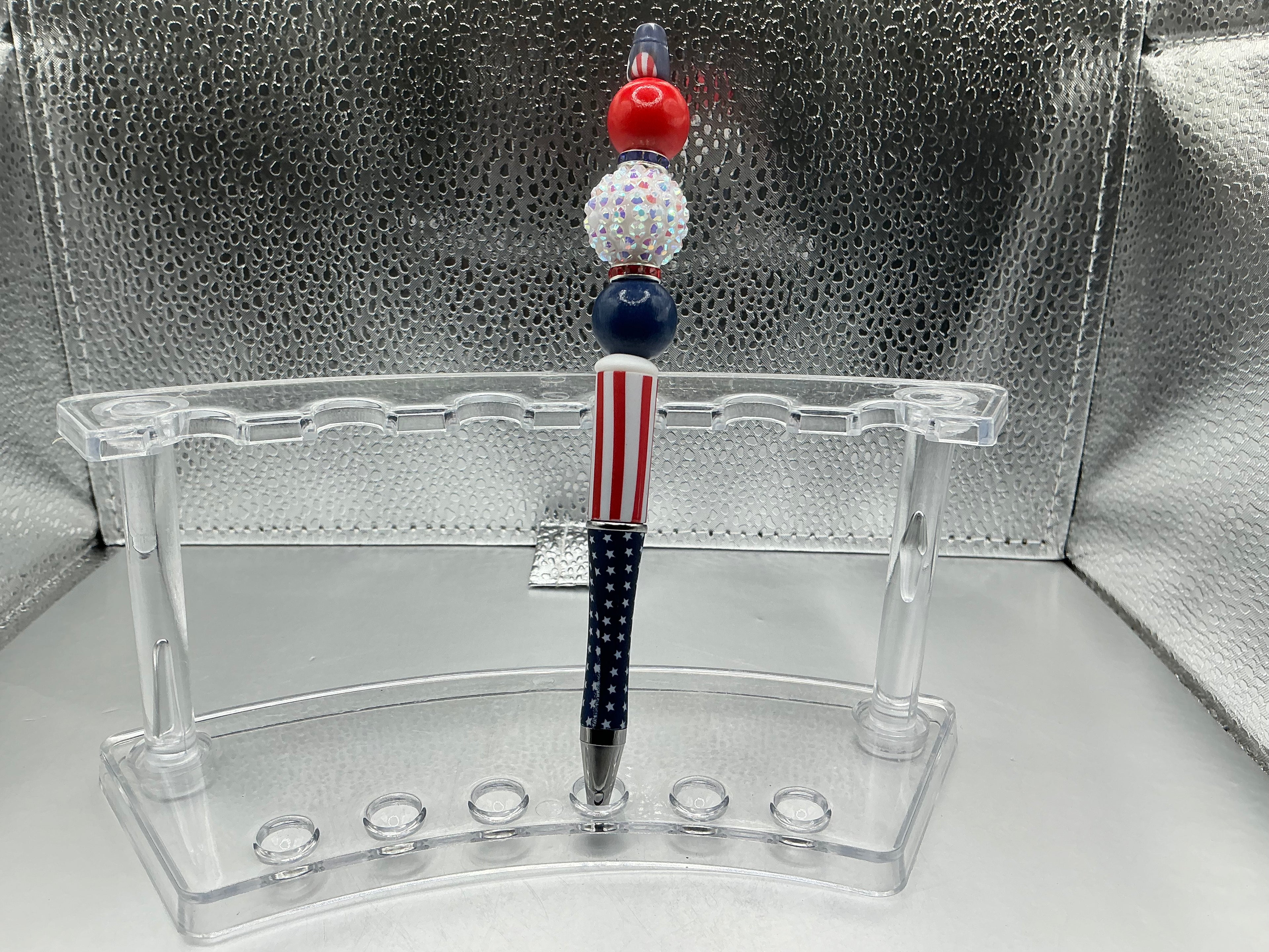 Red, white, and blue balls pen (black ink)