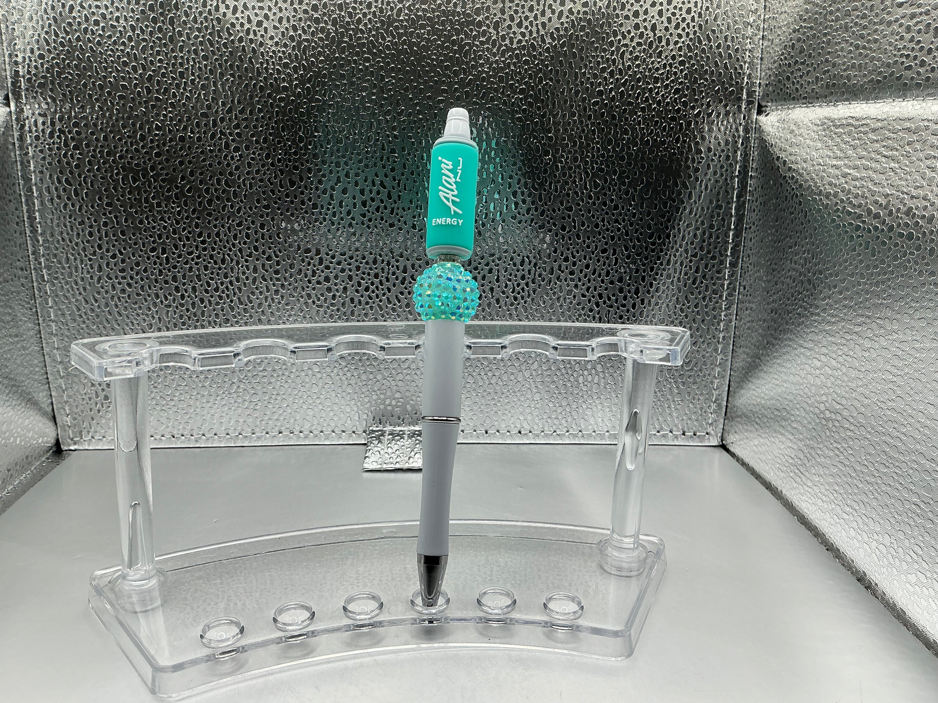 Teal Alani can pen (black ink)
