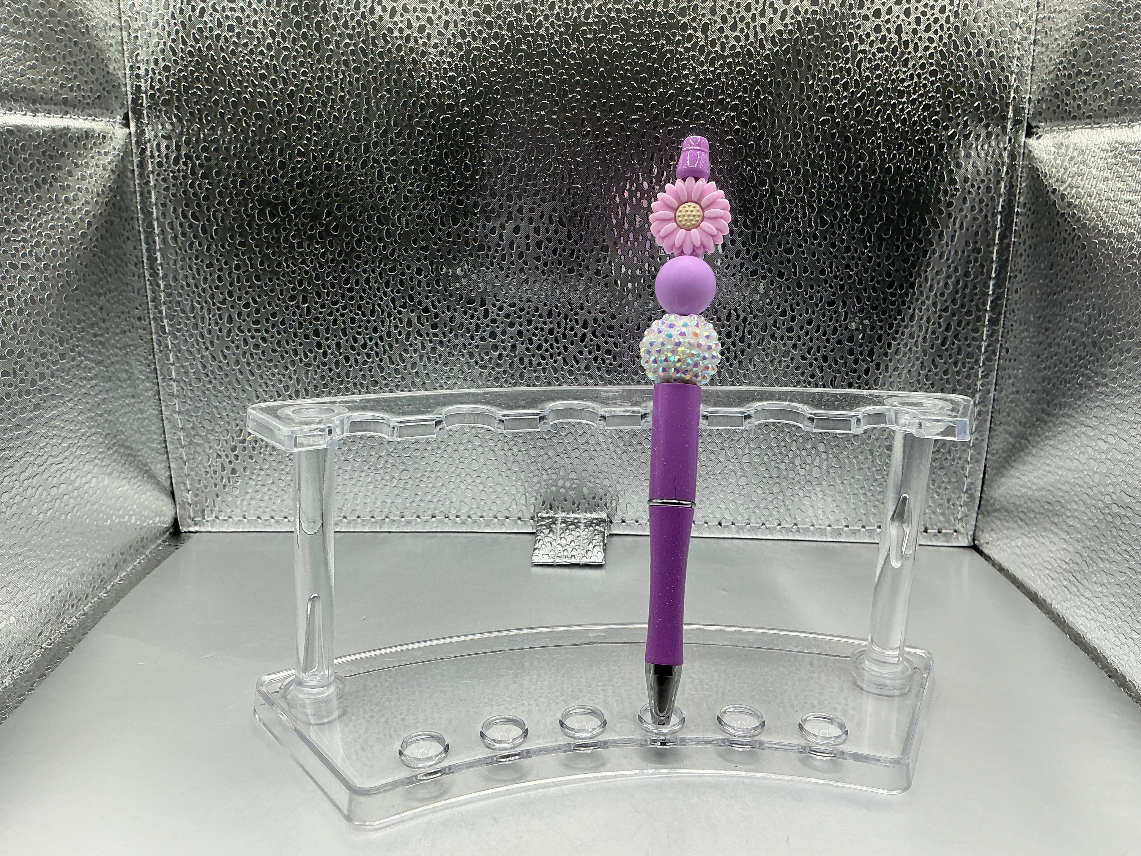 purple flower pen (black ink)