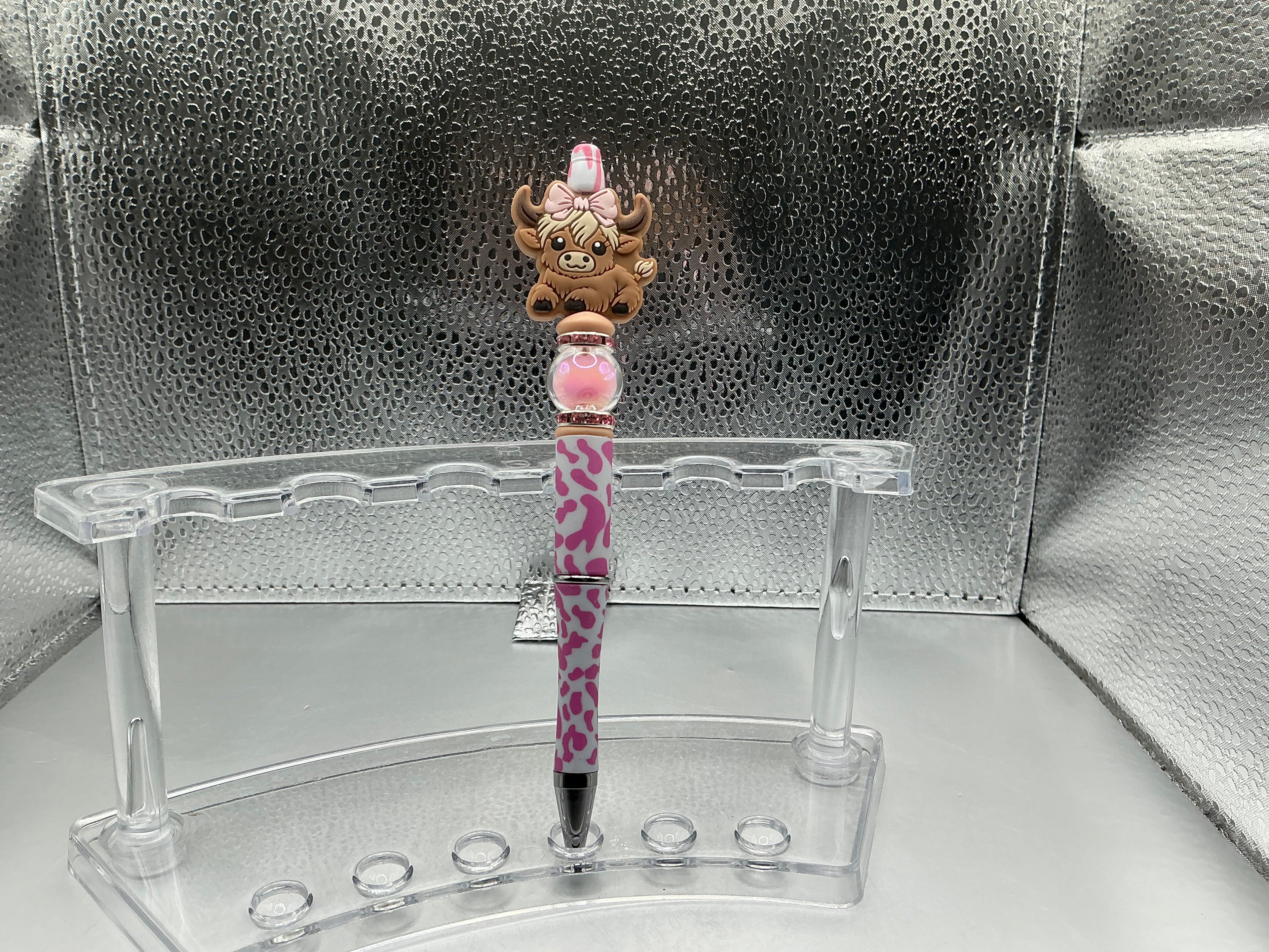 Brown highland cow with a pink bow pen (black ink)