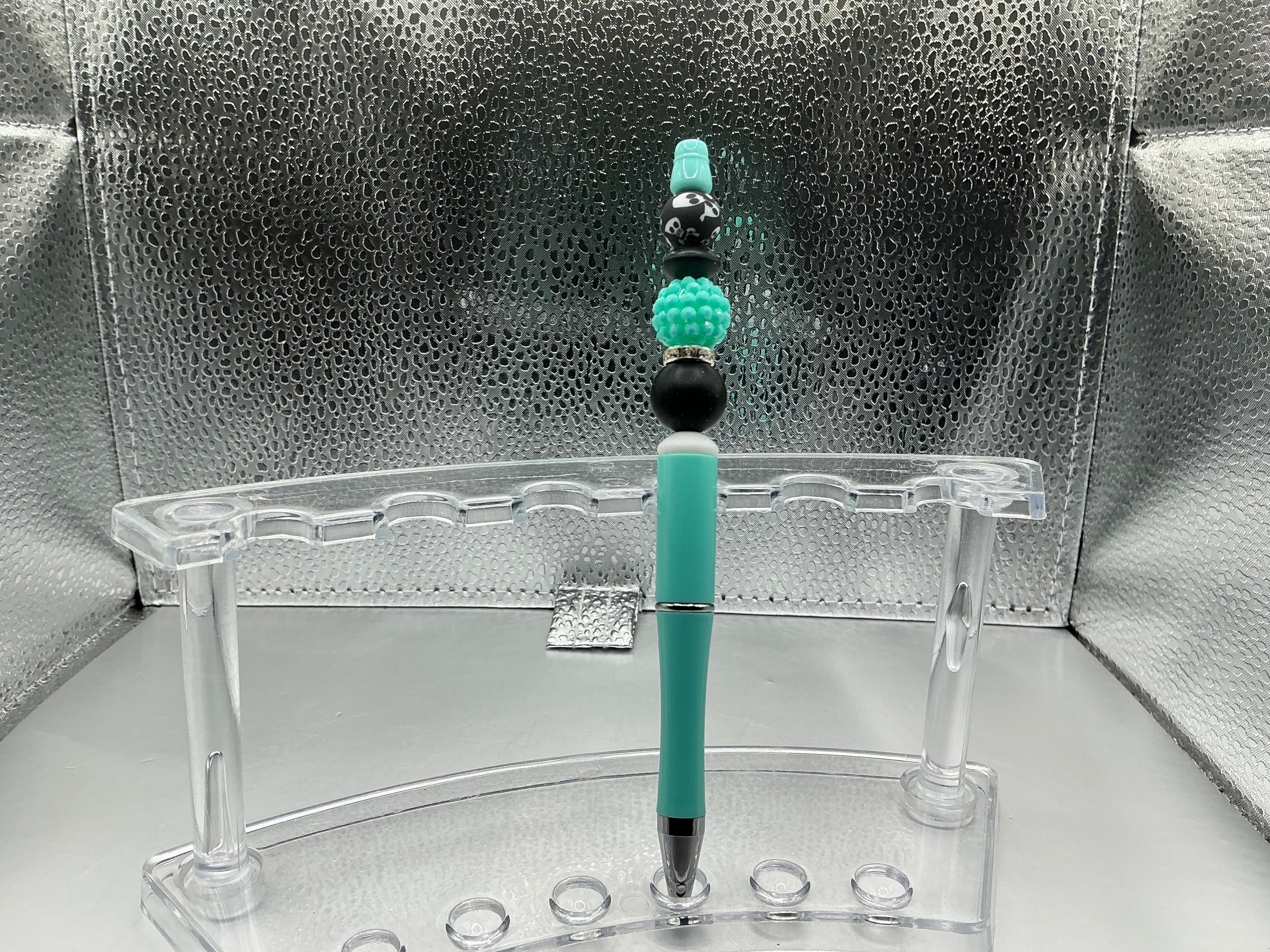 Black and teal balls pen (black ink)