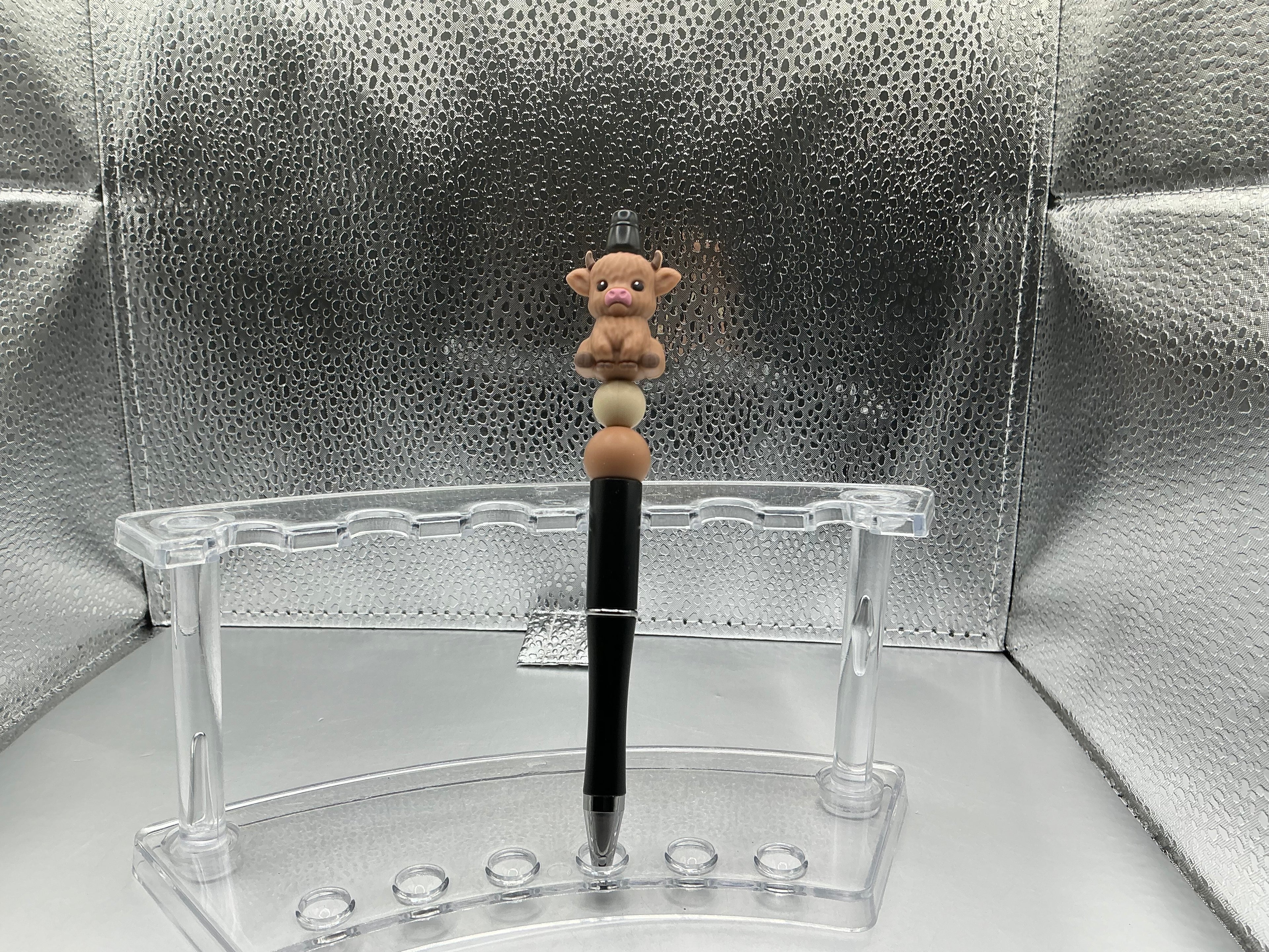 Brown cow pen (black ink)