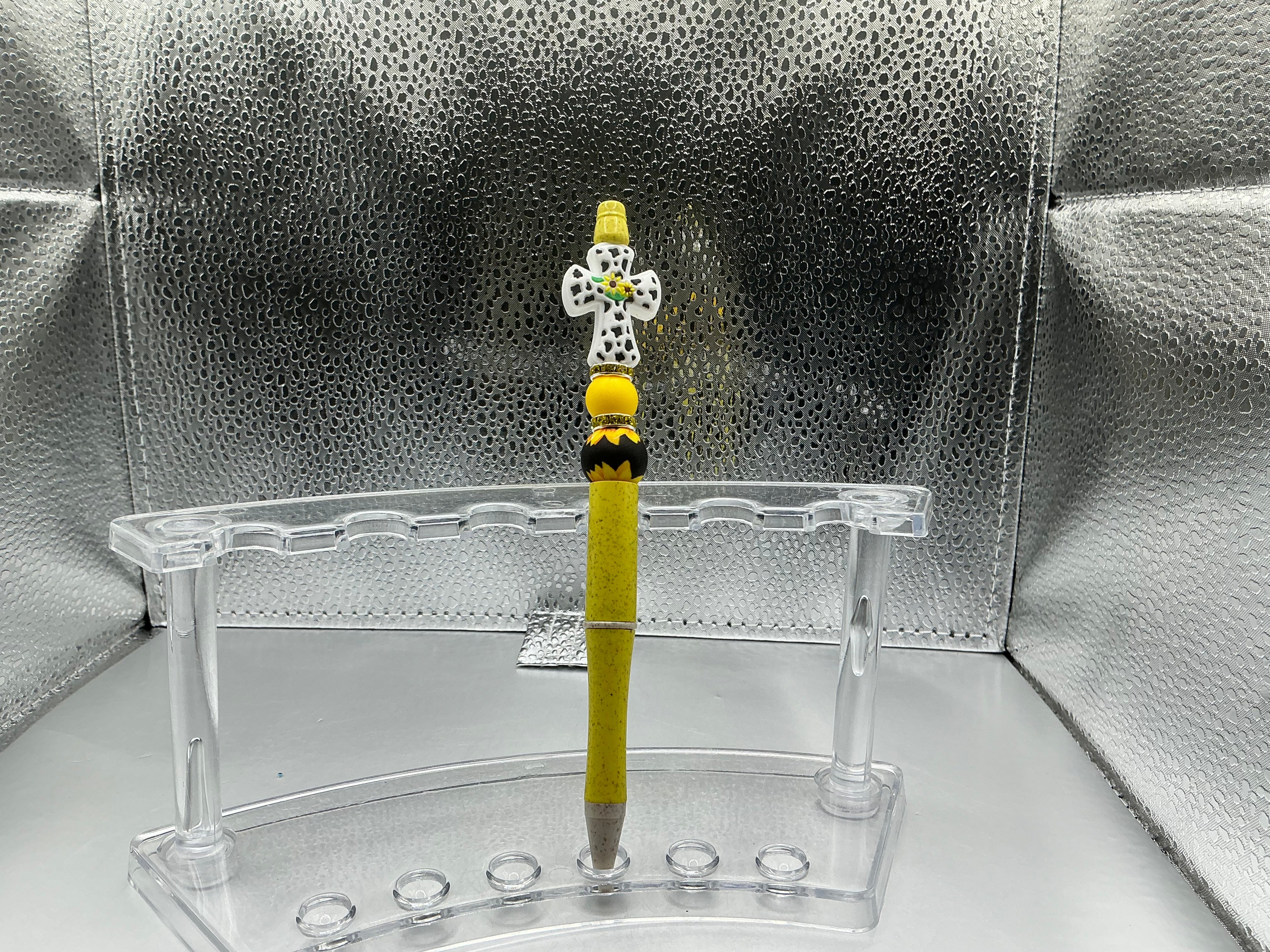 White cross with yellow flowers pen (black ink)