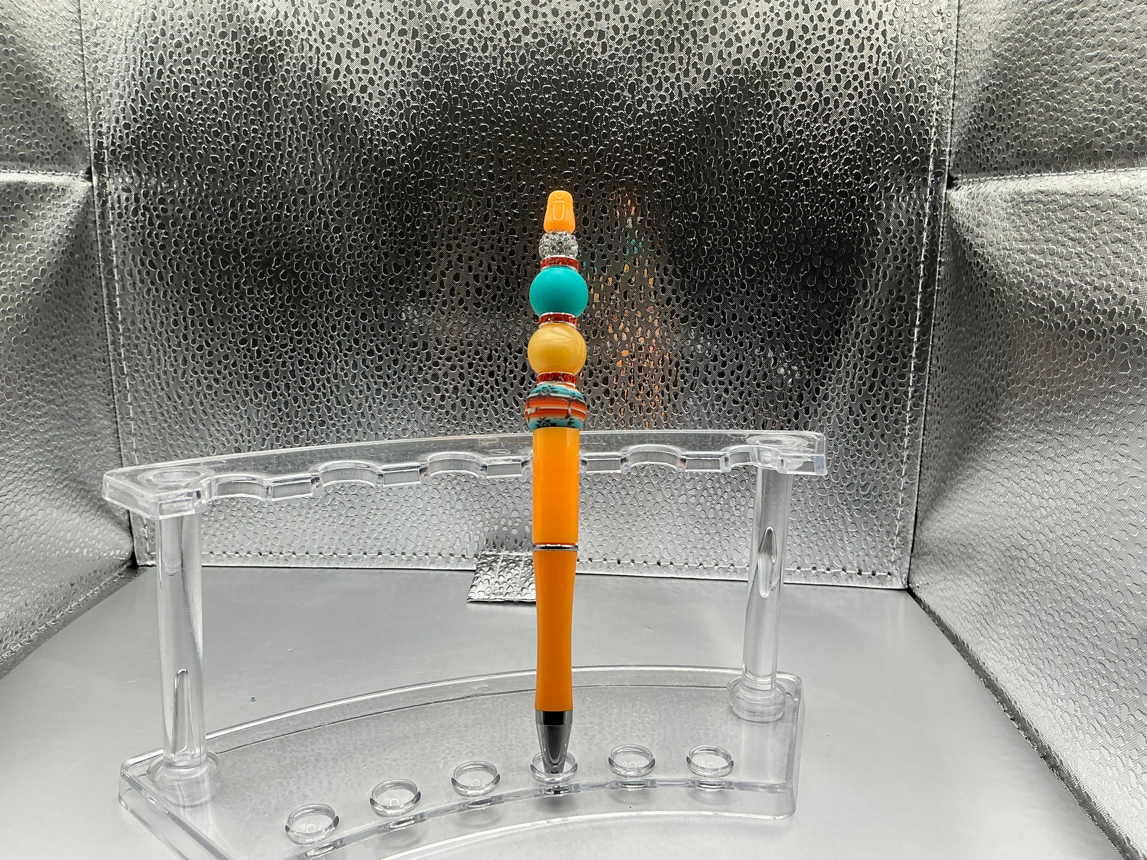 Teal and orange balls pen (black ink)