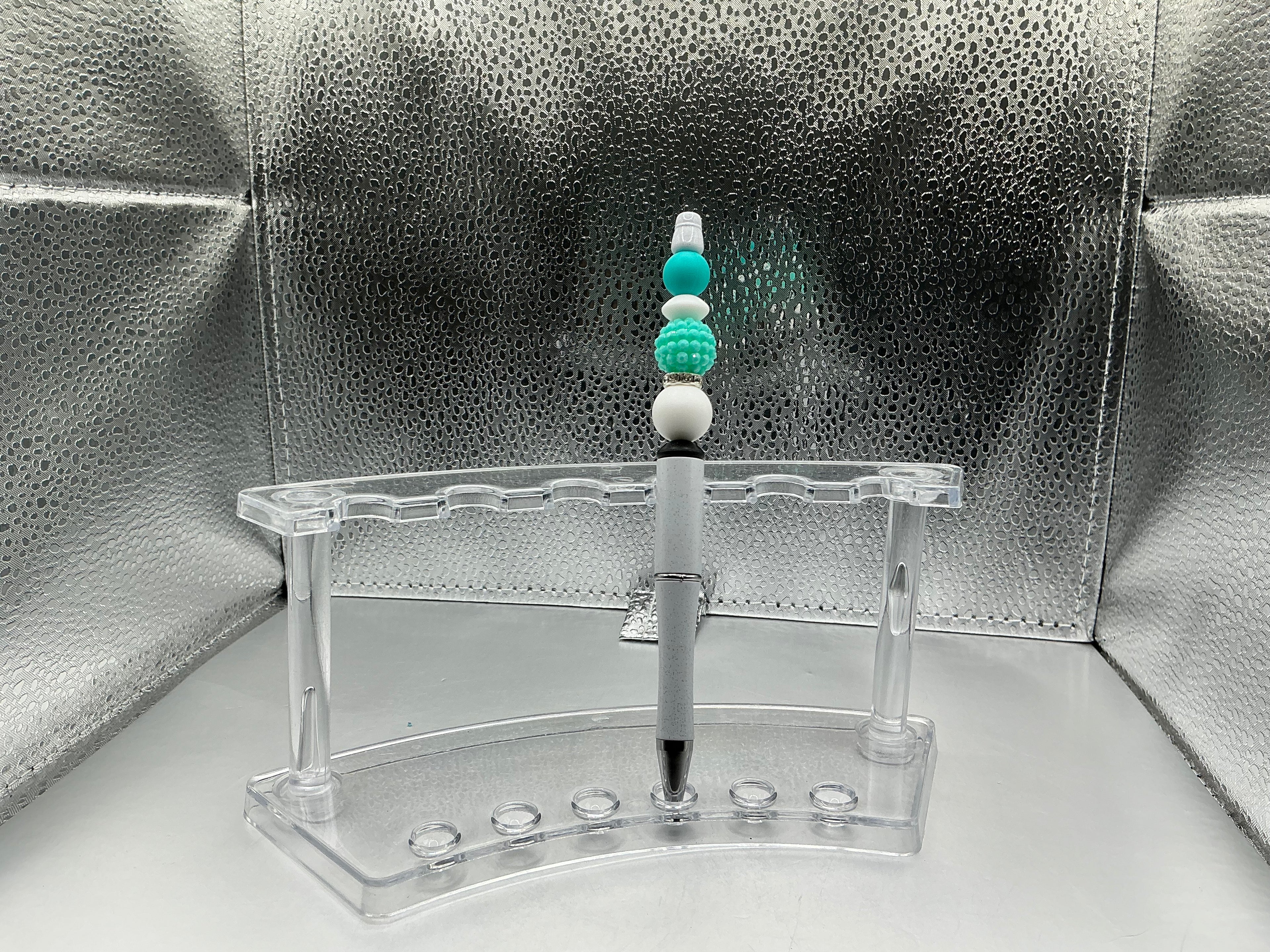 Teal and white balls pen (black ink)