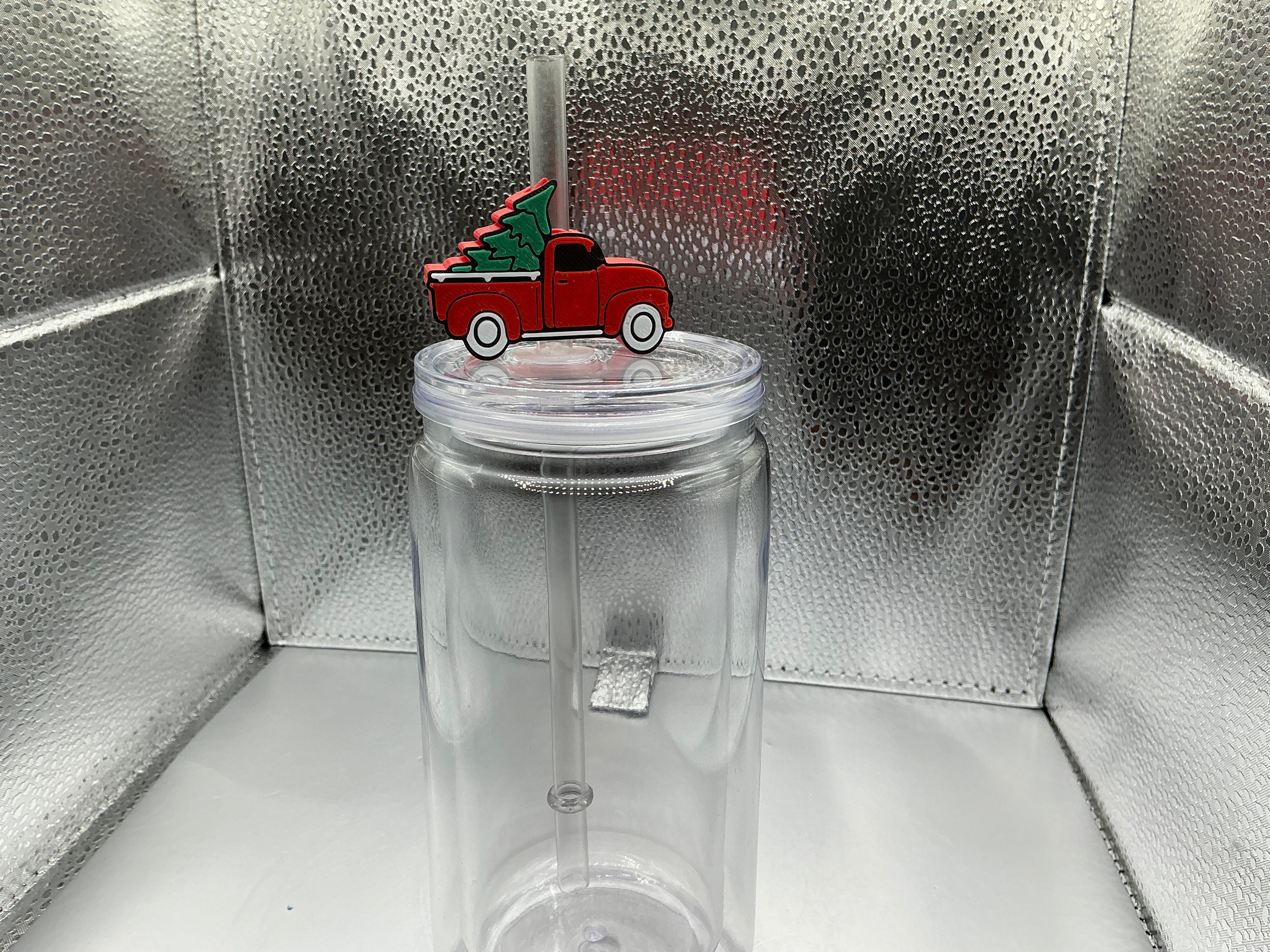 Red truck with a Christmas tree straw topper