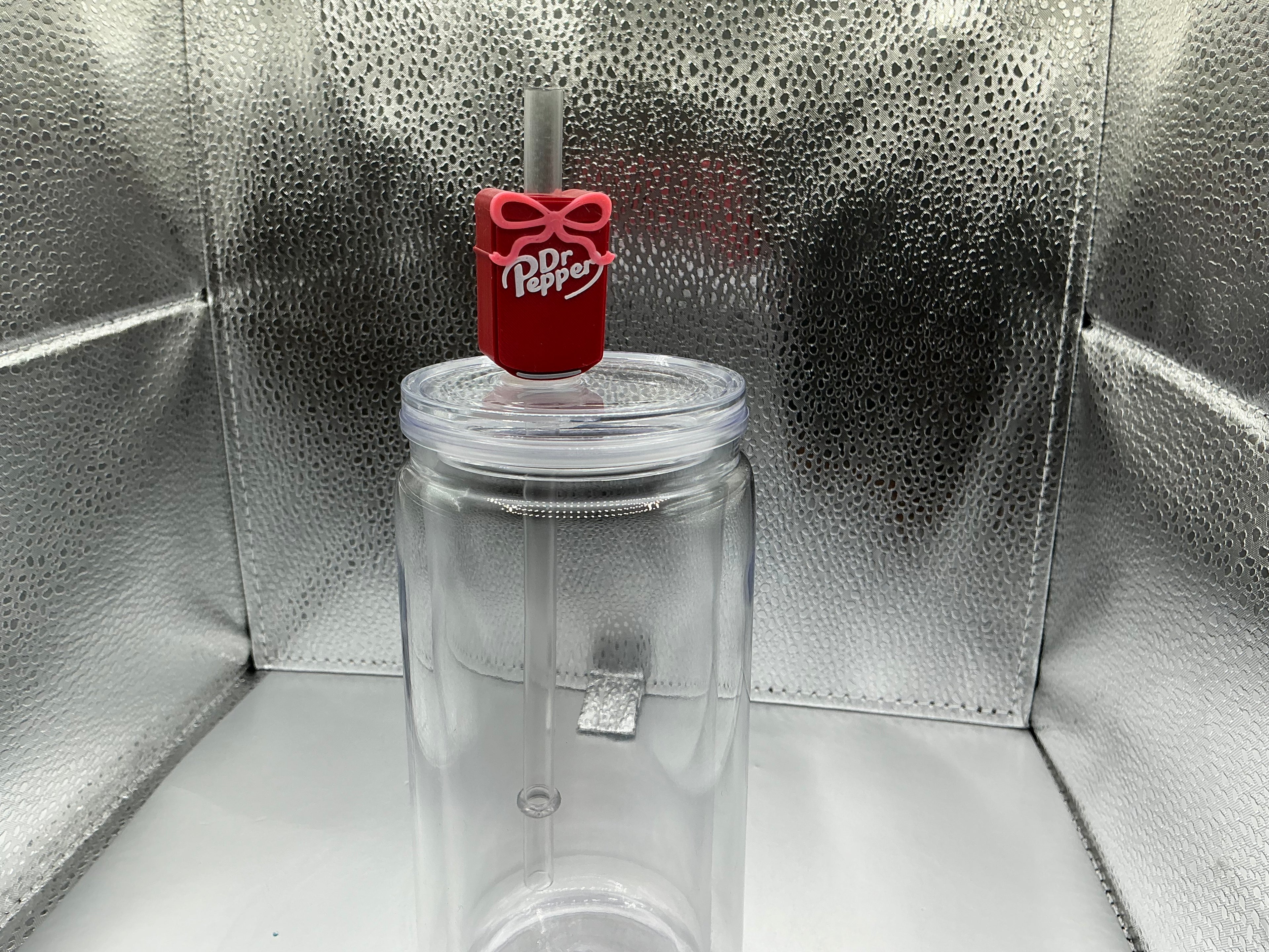 Dr.Pepper with a pink bow straw topper