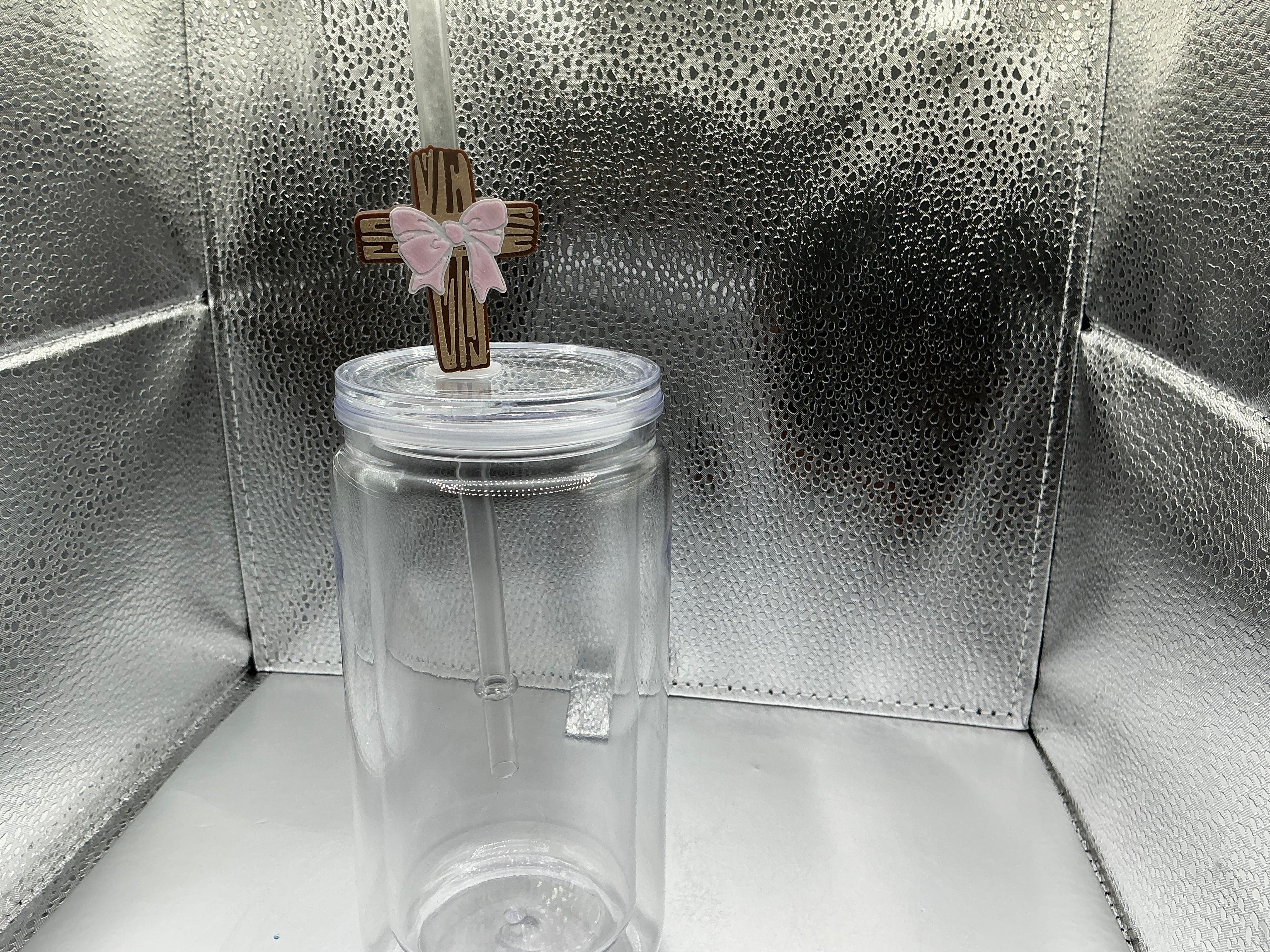 Cross with a pink bow straw topper