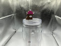 Highland cow with a pink beanie straw topper