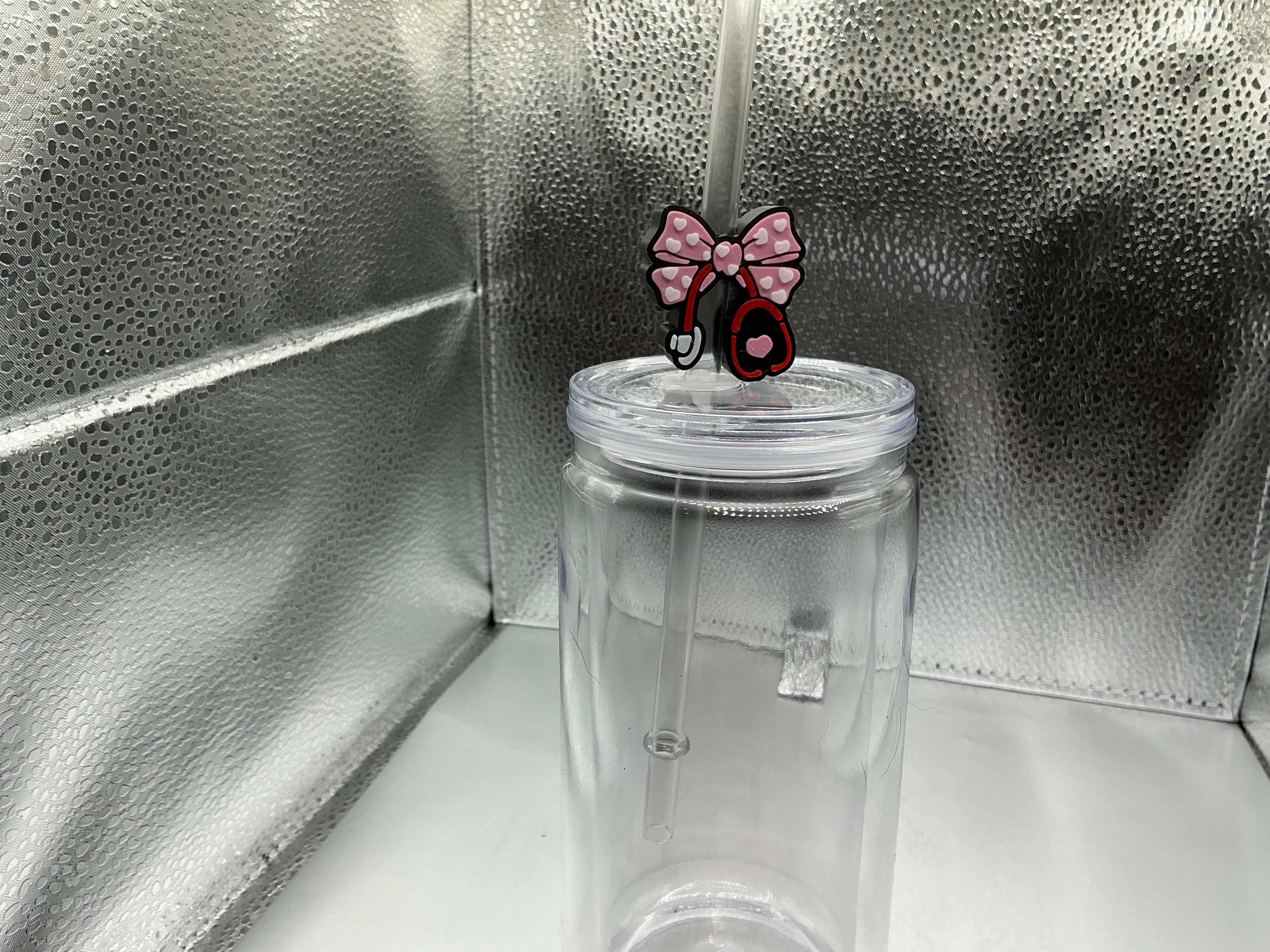 Nurse with a pink bow straw topper