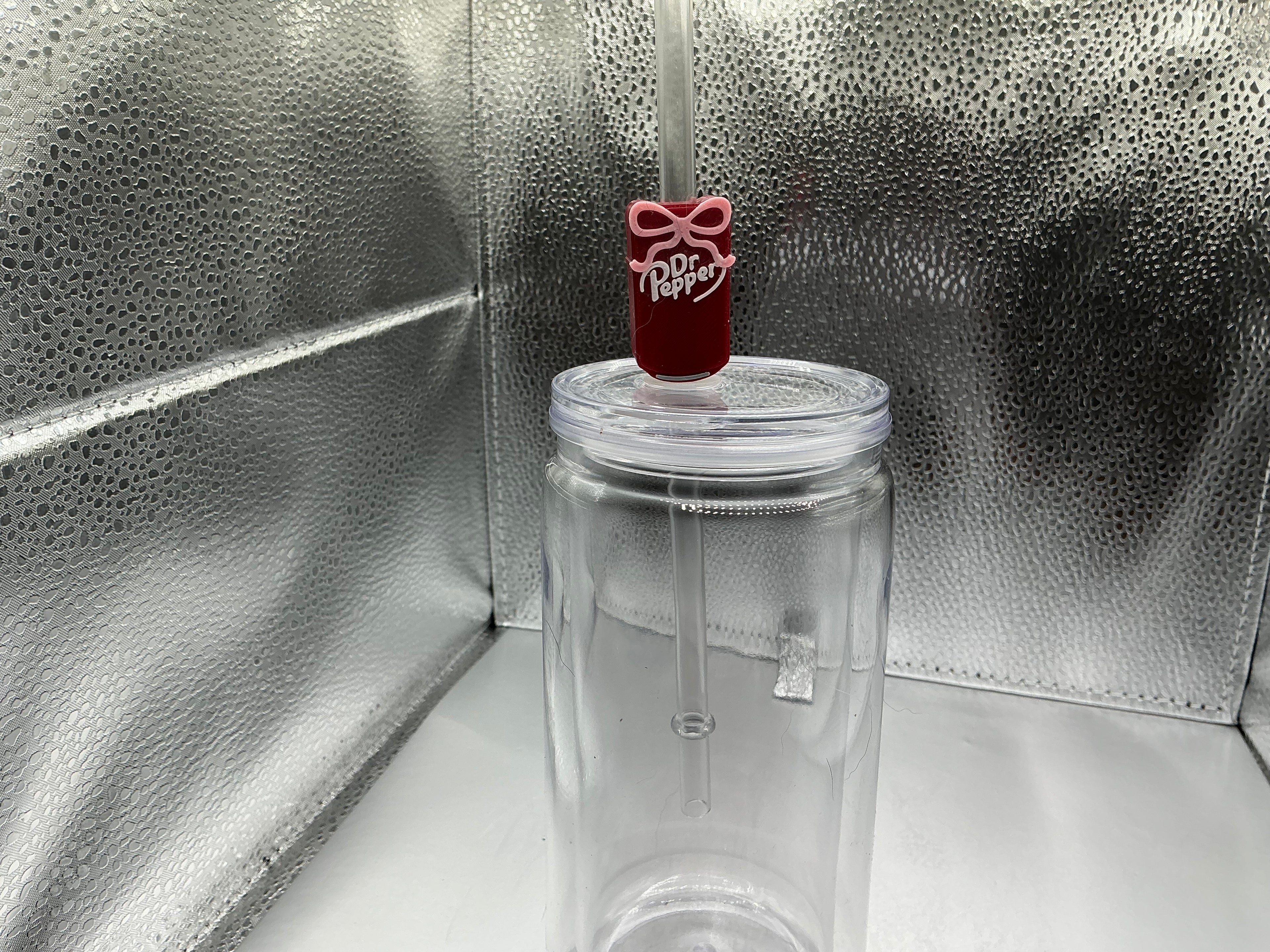 Dr.Pepper with a pink ribbon straw topper