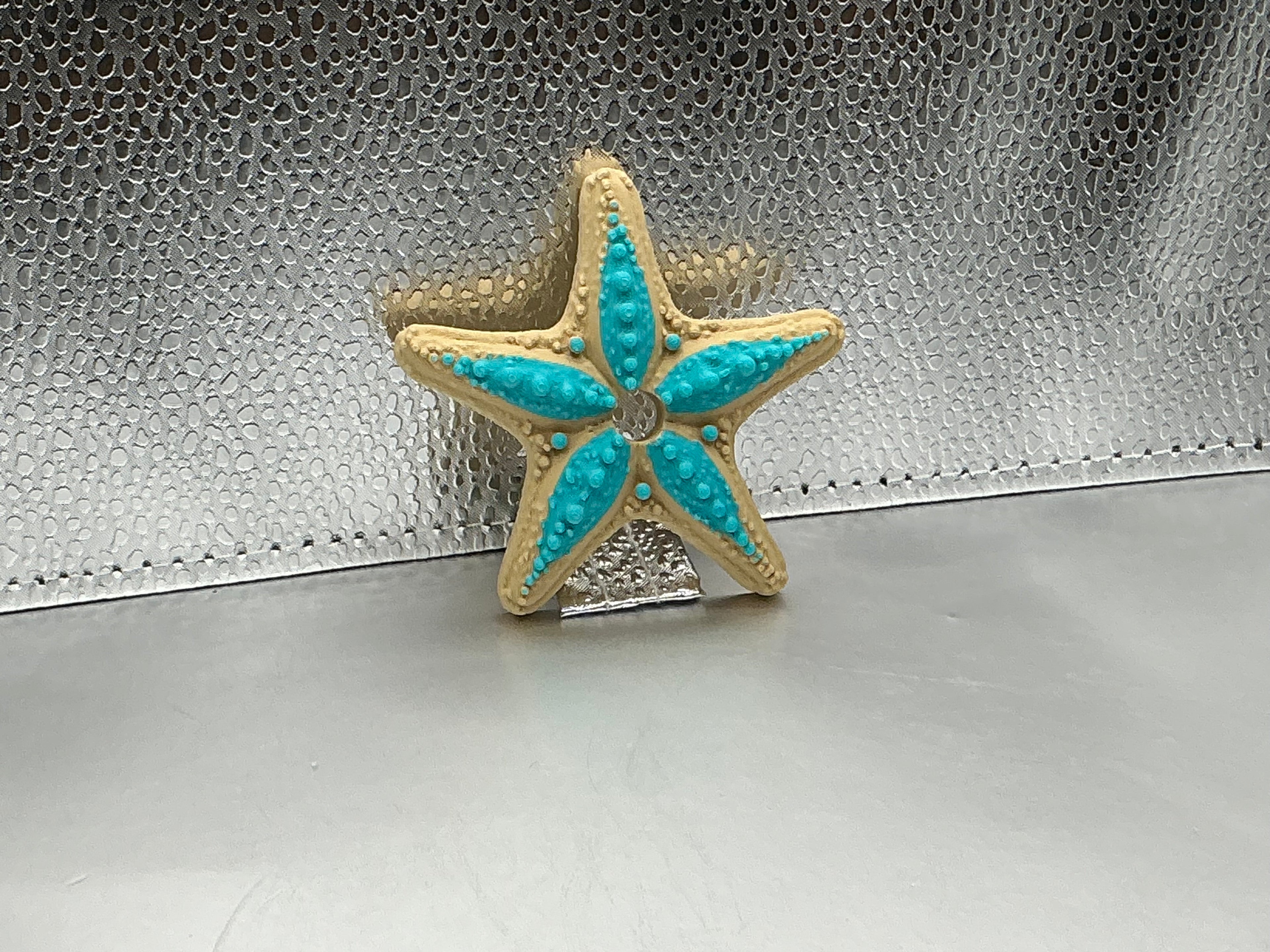 Teal and tan star fish lid topper