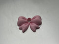 Light pink bow lip topper