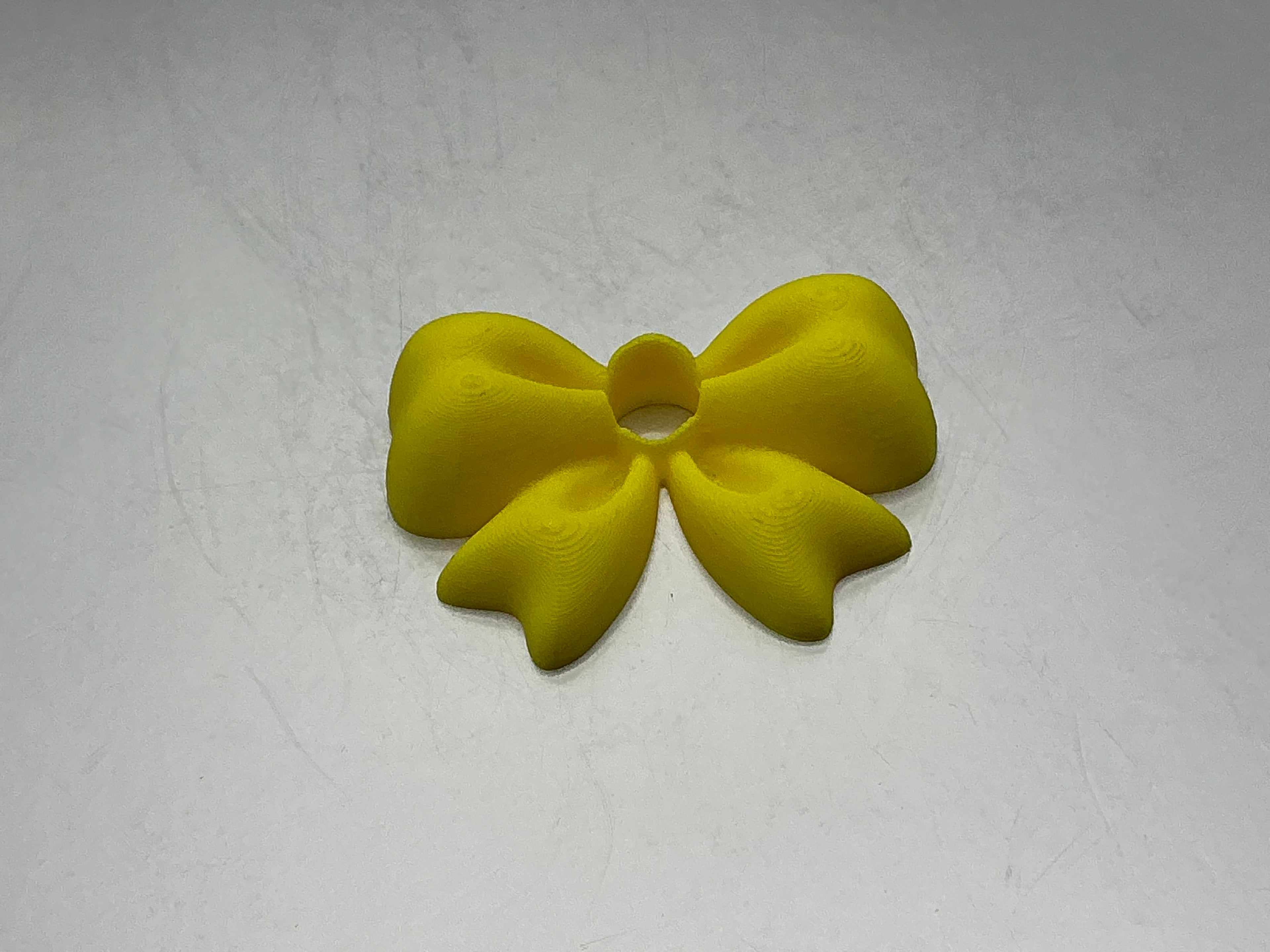 Yellow bow lid topper