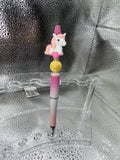Pink and yellow unicorn pen (black ink)