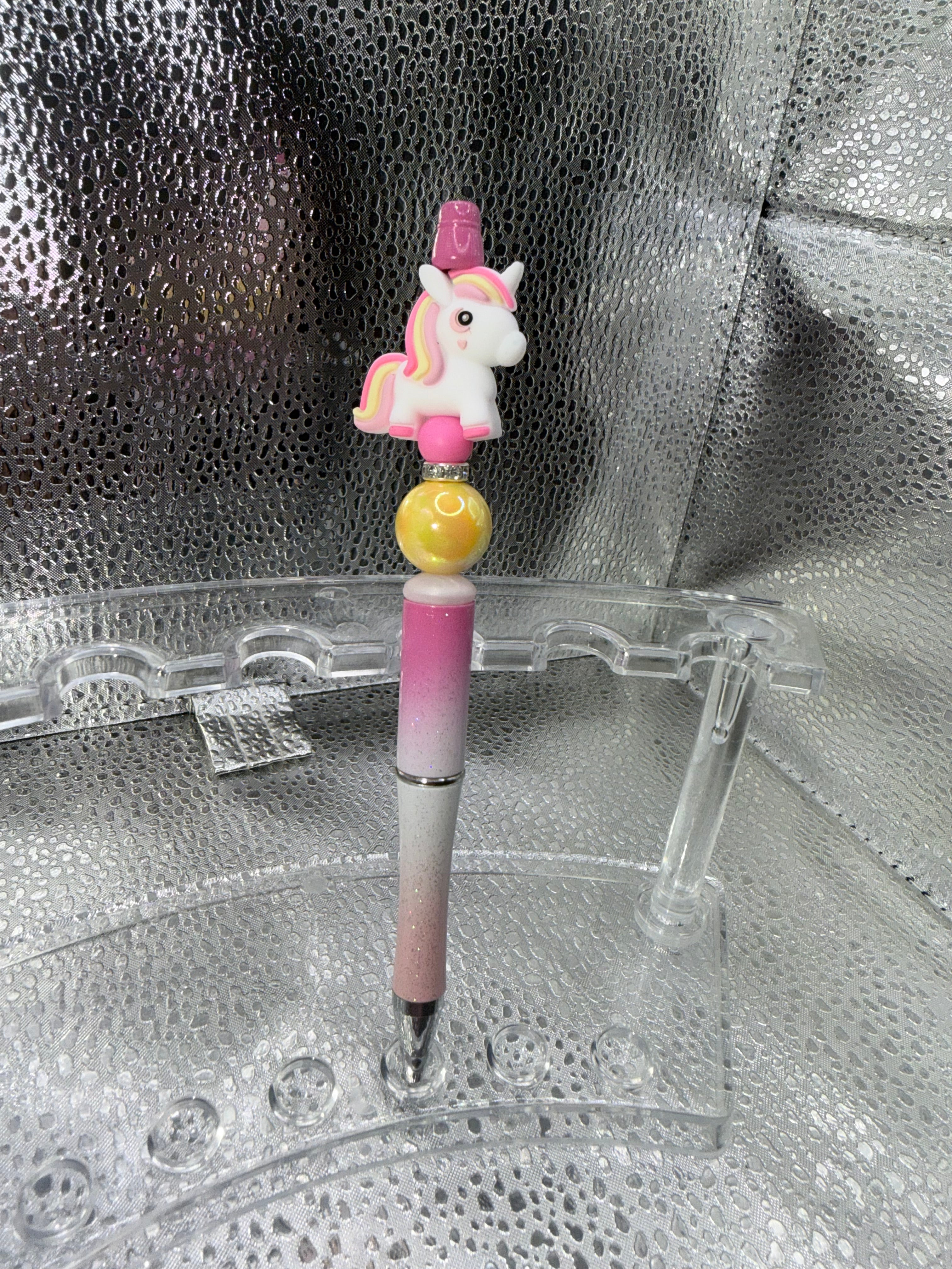 Pink and yellow unicorn pen (black ink)
