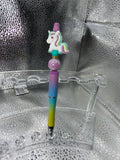 Purple, yellow, and teal unicorn pen (black ink)