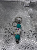 Purple, yellow, and teal unicorn key chain